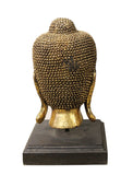 wood Buddha head on stand