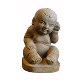 carved stone baby statue