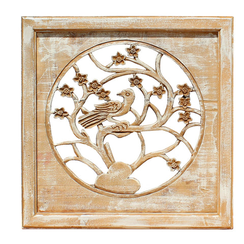 carved wood panel with bird and tree