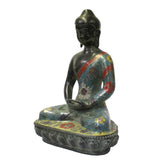 metal Buddha statue on lotus base