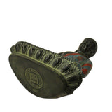 metal Buddha statue on lotus base